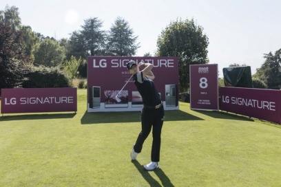 Professional golfer Park Sung-hyun tees off in front of LG SIGNATURE signage.