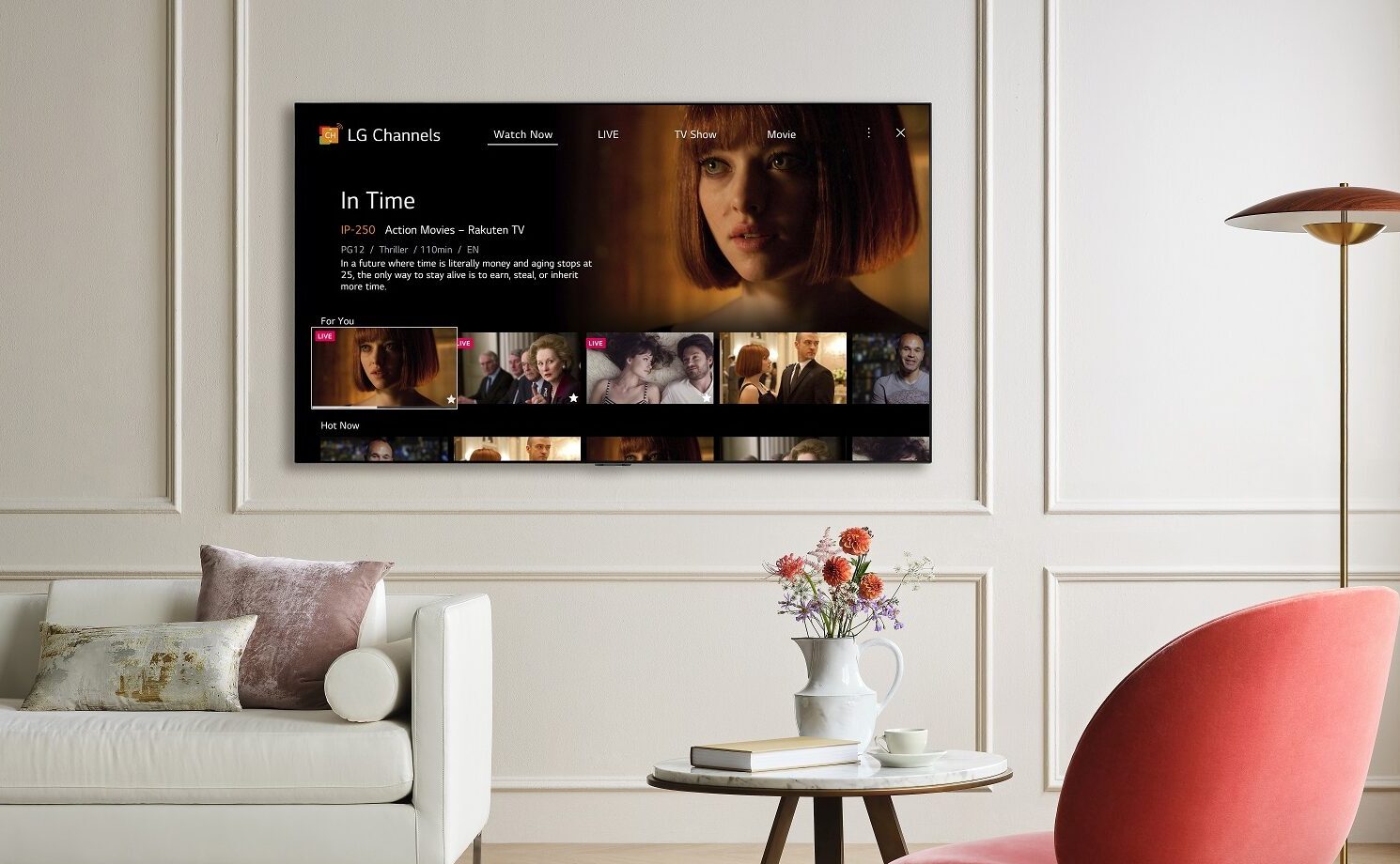 A wall-mounted LG TV in a modern living room displaying LG Channels with the movie 'In Time' on its Watch Now page