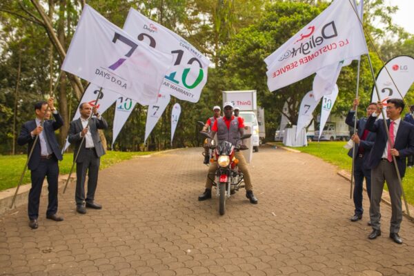 LG technicians riding in on motorcycles in front of LG trucks to celebrate The Last Mile program.