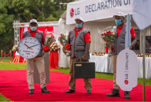 LG's qualified technicians holding flowers at an event commemorating the LG and Opalnet partnership.
