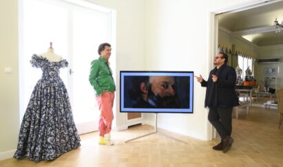 Fashion designer Vassilis Zoulias (right) and interior designer Georgios Carabellas pictured with LG G1 OLED displaying “Self-Portrait” by Paul Cézanne at Zoulias’s showroom