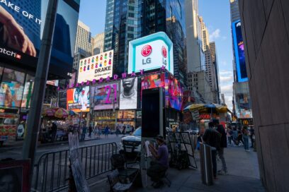 A busy Times Square, New York City, with billboards and LG’s logo lighting up the world-famous landmark.