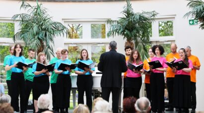 A choir singing in front of an audience at the Hurlingham Club Arts Festival.