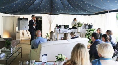 People participating in a wine tasting session hosted by a sommelier from the Honest Grapes wine club during the Hurlingham Club Arts Festival.