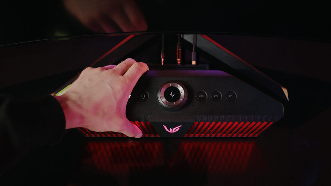 A gamer grasping an LG UltraGear Gaming Speaker (model GP9)