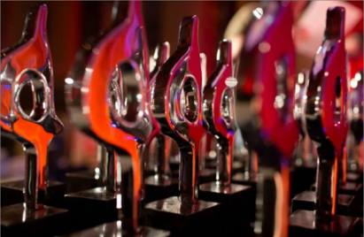 A close-up of several SABRE Award trophies.