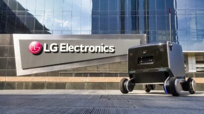 LG’s four-wheeled indoor-outdoor delivery robot in front of the LG Electronics building.