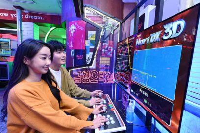 A couple playing an arcade game at Gold Star Arcade in Seoul.