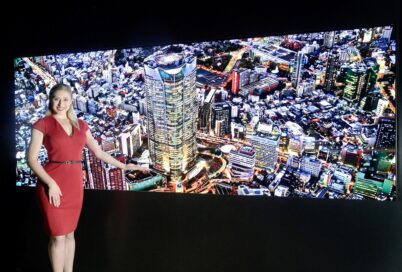 A woman presents LG’s Micro LED display