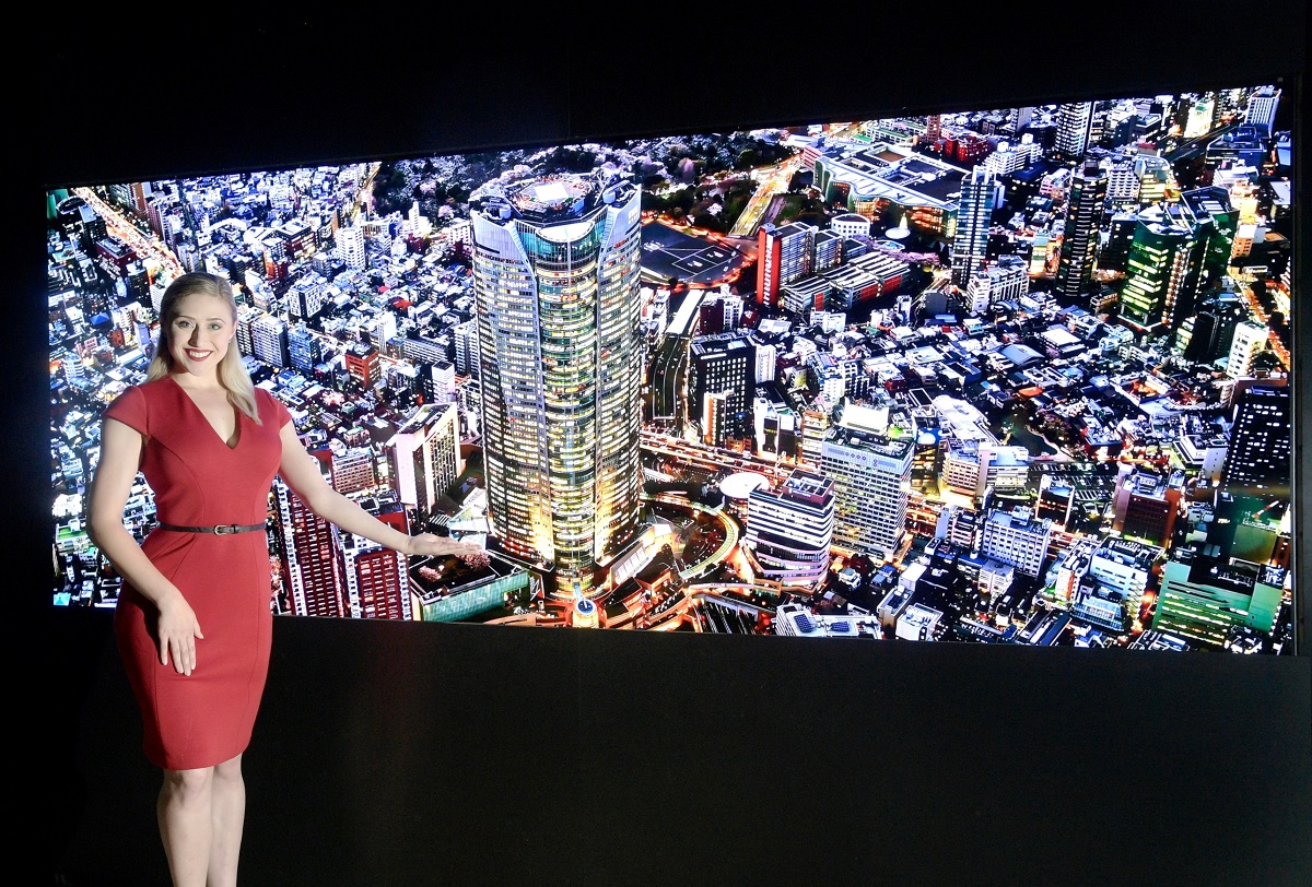 A woman presents LG’s Micro LED display 