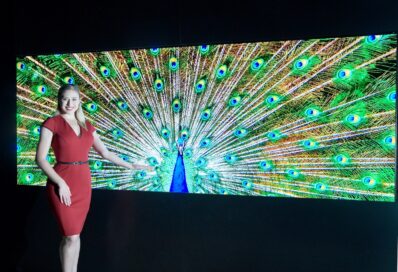 A woman presents LG’s Micro LED display