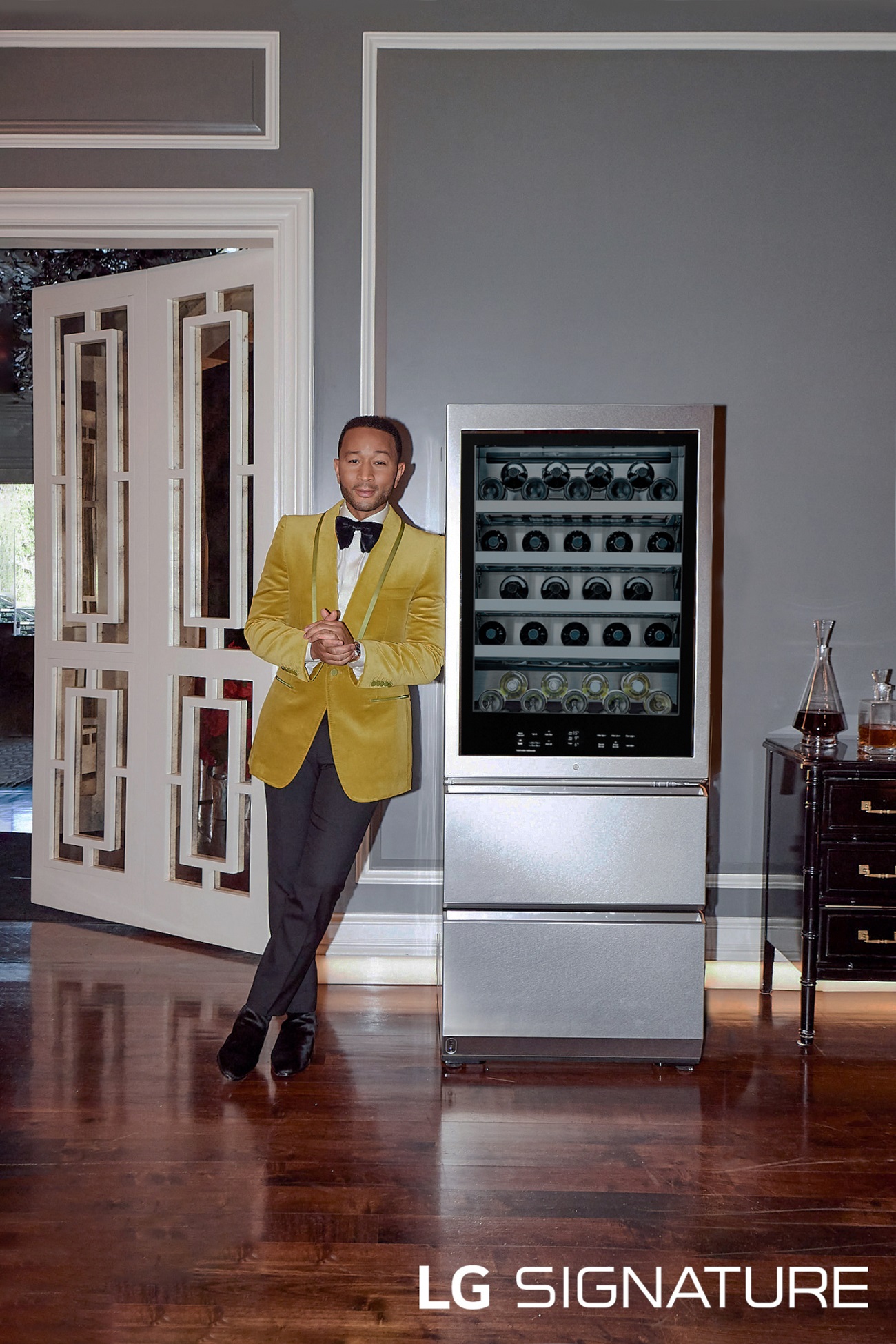 An image of John Legend leaning against LG SIGNATURE Wine Cellar