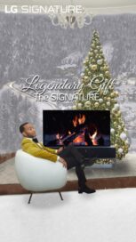 An image of John Legend sitting on a sofa chair in front of LG SIGNATURE OLED R
