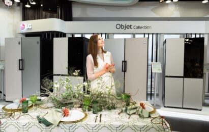 Actress Glafira Tarkhanova posing in front of LG Objet refrigerators at the showcase in Russia.