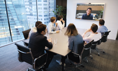 A team meeting with colleagues taking a video call via LG’s One:Quick Works.