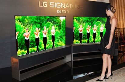 An ABT Fall Gala guest taking a closer look at LG SIGNATURE OLED R.