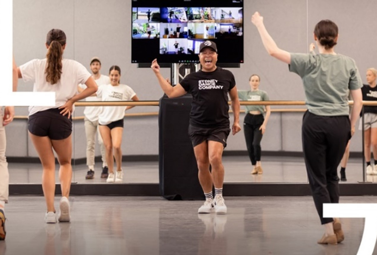 Performers of the Sydney Dance Company practicing in the studio
