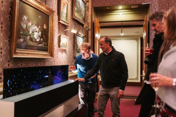 Participants of Christmas at the Hall event taking a closer look at LG SIGNATURE OLED R