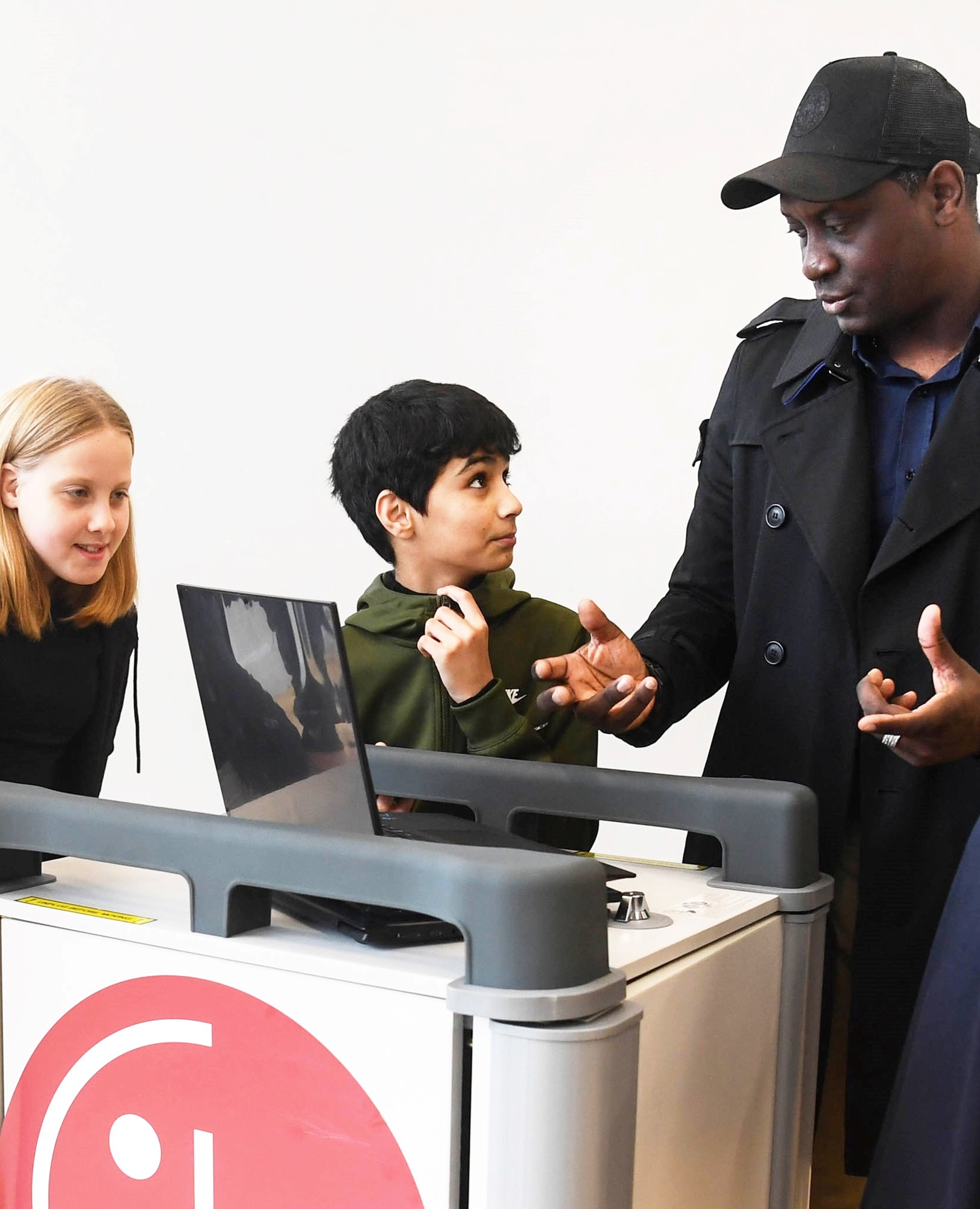 English football legend Emile Heskey talking to a student benefitting from the LG Laptop Libraries program.