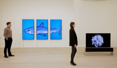 From left, 'THE S/H/A/R/K' by Damien Hirst and 'The Moment & Morpho Luna' by Je Baak displayed on LG OLED TVs at Saatchi Gallery