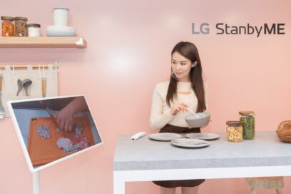 The Hong Kong launch event’s Kitchen Zone with a woman preparing a meal with the help of a cooking video displayed on LG StanbyME.