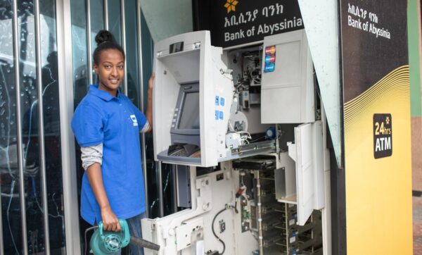A graduate of LG-KOICA Hope TVET College repairing an ATM machine