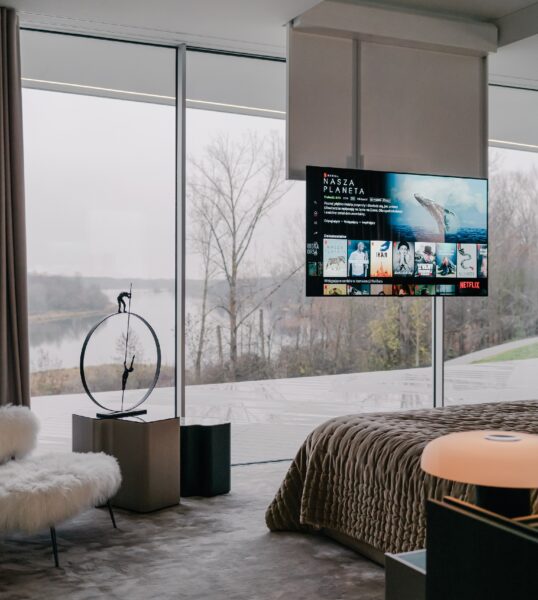 A photo of the bedroom with LG's ceiling-mounted 65-inch OLED TV
