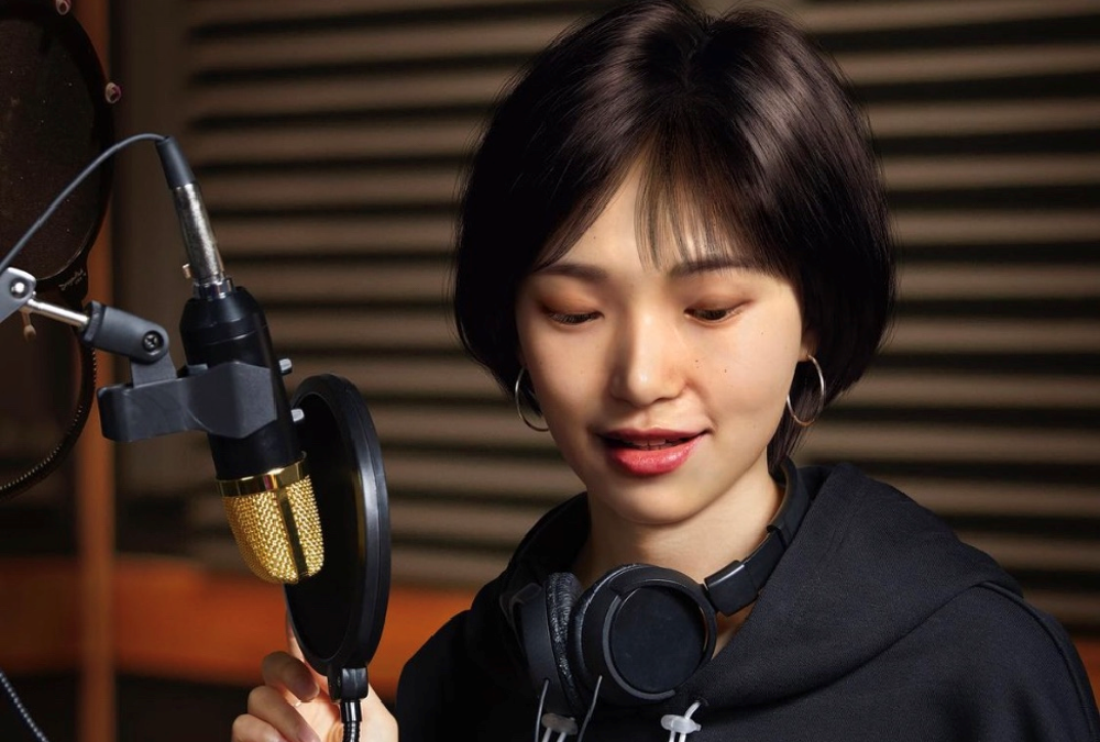 Virtual artist Reah Keem recording a song in the studio.