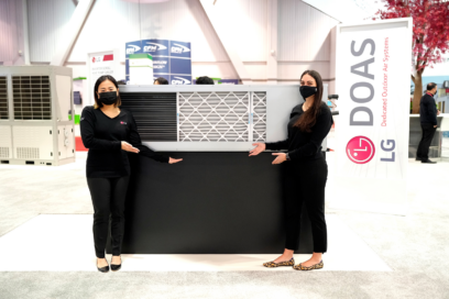 Two models posing in front of LG HVAC appliance