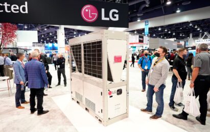 Two visitors of AHR Expo checking out LG HVAC appliance