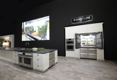 Signature Kitchen Suite built-in French Door refrigerator is displayed with other kitchen appliances in the LG booth at Kitchen and Bath Industry Show 2022