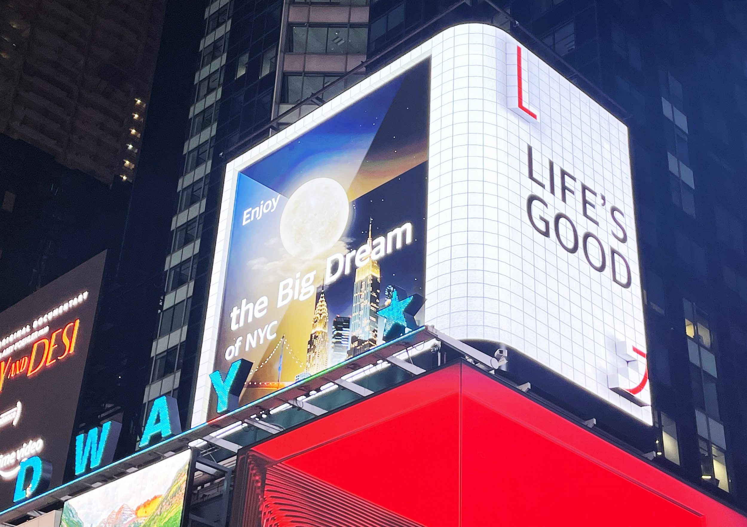 LG's digital billboard in Time Square, New York displaying an illustration of NYC with the phrase 'Life's Good'