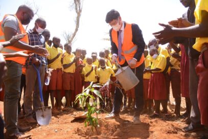 LG Electronics East Africa Managing Director Kim Sa-nyoung watering a plant as a part of action to commemorate the social initiative to build supplies for schools in Kenya