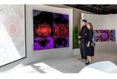 Two visitors viewing Kevin McCoy's work of art displayed on LG OLED TV