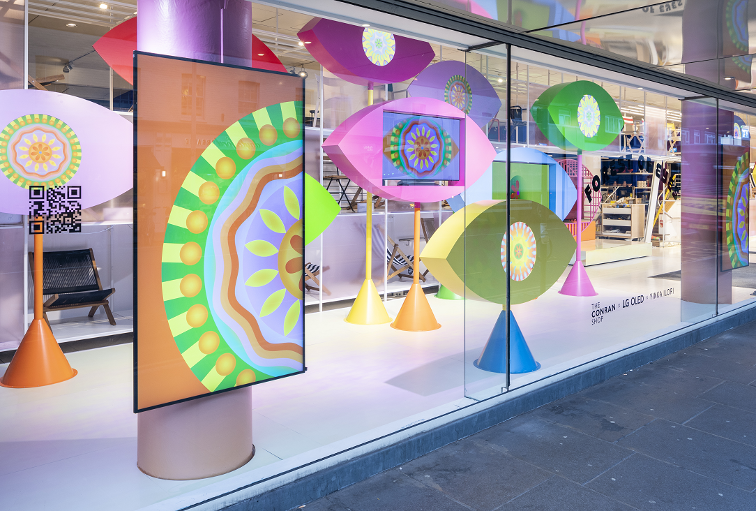 LG OLED evo TVs featured in Yinka Ilori's art installations titled 'Forest of Eyes' in the display window at the Conrad Shop