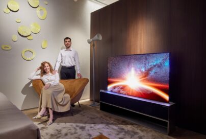 Two visitors posing with LG OLED R during Milan Design Week 2022