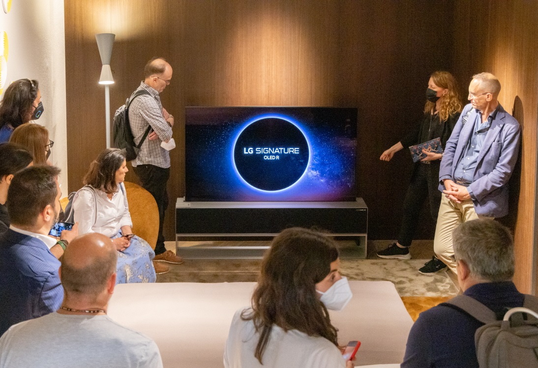 Visitors taking a closer look at LG OLED R during Milan Design Week 2022