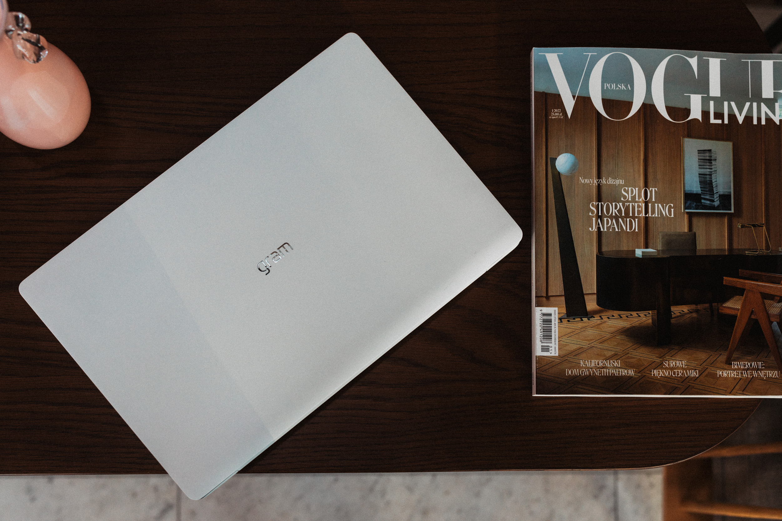 LG gram placed next to the first edition of Vogue Polska magazine