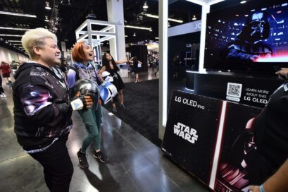 Visitors taking a look at LG OLED TV showcased at the Star Wars celebration in Anaheim, California