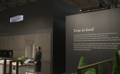 A part of LG SIGNATURE booth at Milan Design Week 2022 with a wall displaying Signature Kitchen Suite's 'True to Food' philosophy