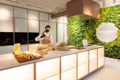 Staff preparing small dish at Signature Kitchen Suite showroom