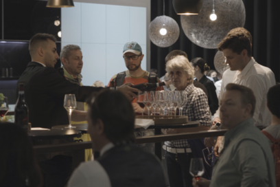 Visitors enjoying a drink at Signature Kitchen Suite showroom during Milan Design Week 2022