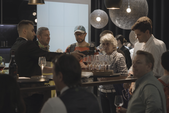 Visitors enjoying a drink at Signature Kitchen Suite showroom during Milan Design Week 2022 