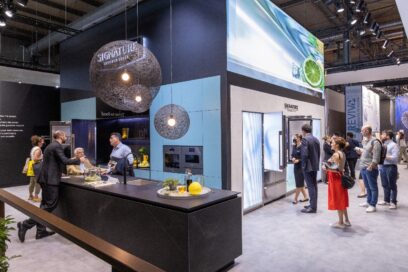 The view of LG SIGNATURE booth at Milan Design Week 2022 with visitors taking a closer look at appliances