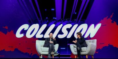 A photo of a host and a guest having a discussion at the Collision event