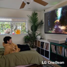 Jeremy Zucker watching a screen projected by LG CineBeam