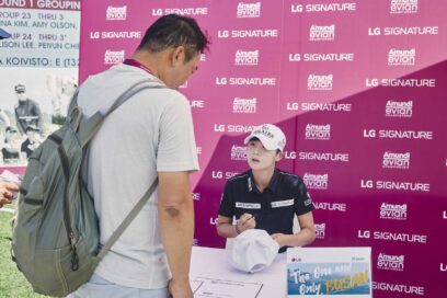Golfer Park Sung-hyun signing a fan’s hat at the Amundi Evian Championship sponsored by LG SIGNATURE