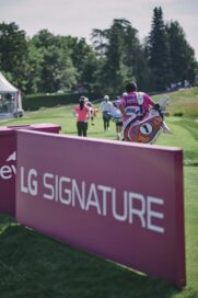 LG SIGNATURE signage at the Amundi Evian Championship as golfers move through the course