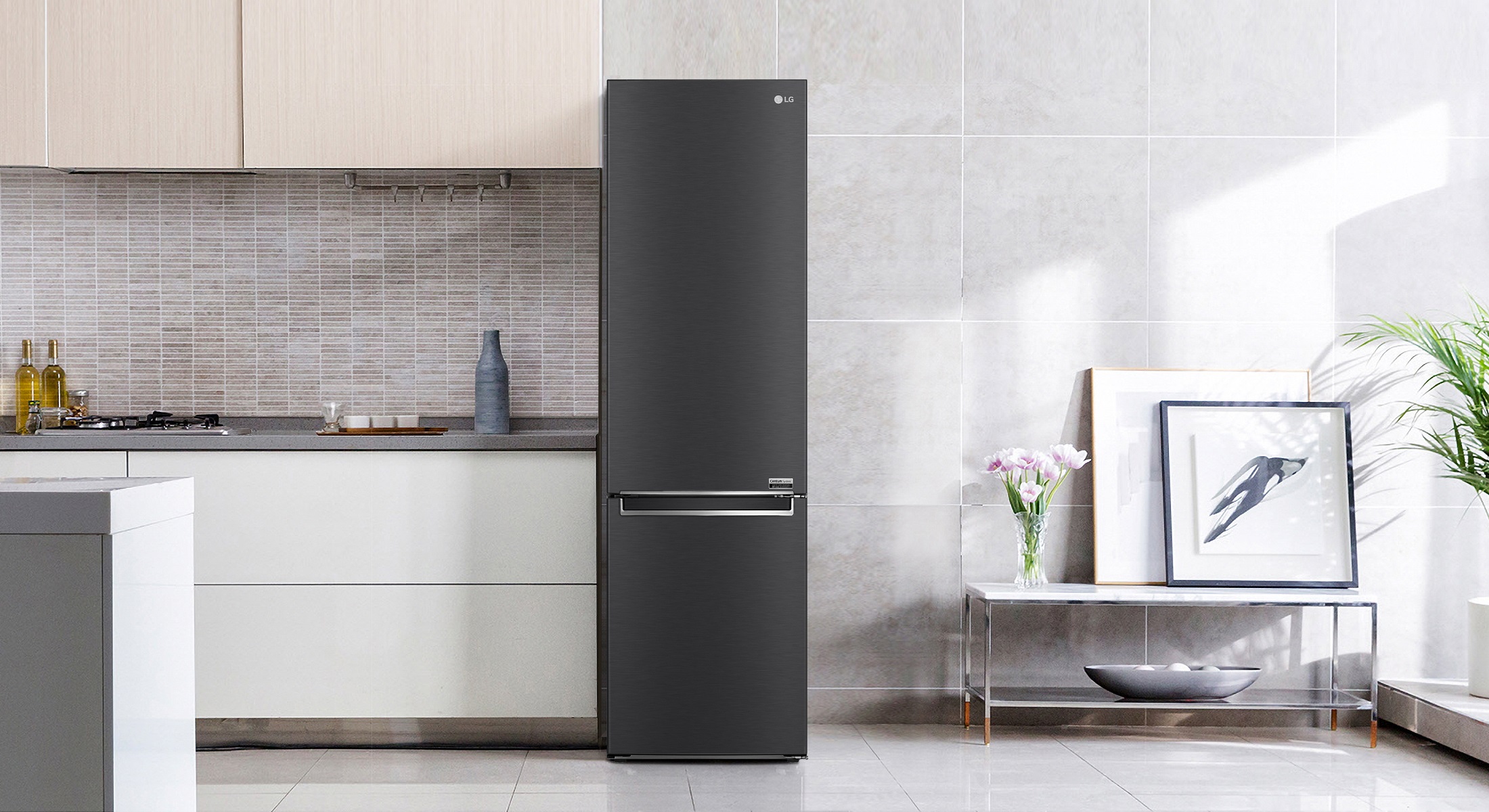 LG's new bottom freezer with top-tier energy efficiency is placed next to the kitchen drawers