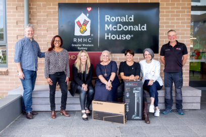 The staff of RMHC posing together for a photo with donated LG products